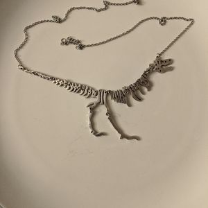 Silver tone T Rex necklace